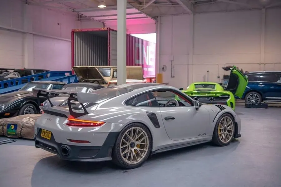 Porsche GT2 RS prepared for container export shipping at ShipMyCar facility